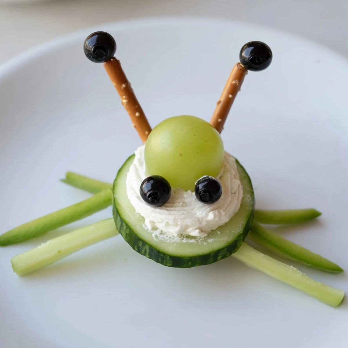 Bright green Little Green Men Alien Snack Attack ready on a platter, perfect for a kids' party.