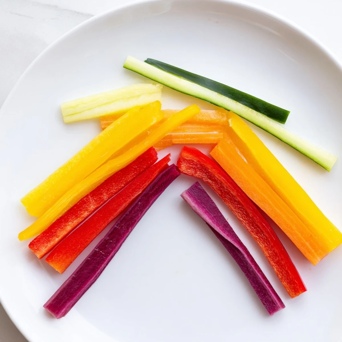These colorful Rainbow Arch Veggie Sticks offer a healthy, delicious rainbow snack with optional hummus.