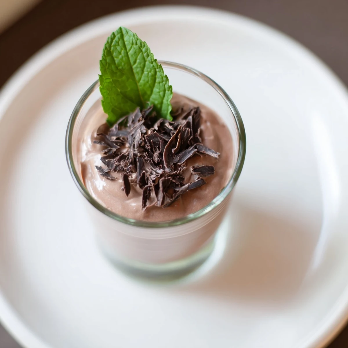 Decadent chocolate mousse dessert cups, perfectly chilled and garnished with fresh berries for a treat.