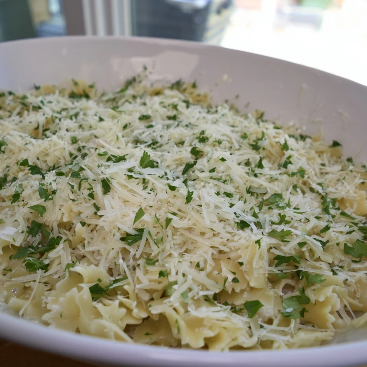 Steaming 15-Minute Garlic Parmesan Pasta, coated in a luscious, creamy, dairy-based sauce and fresh Parmesan.