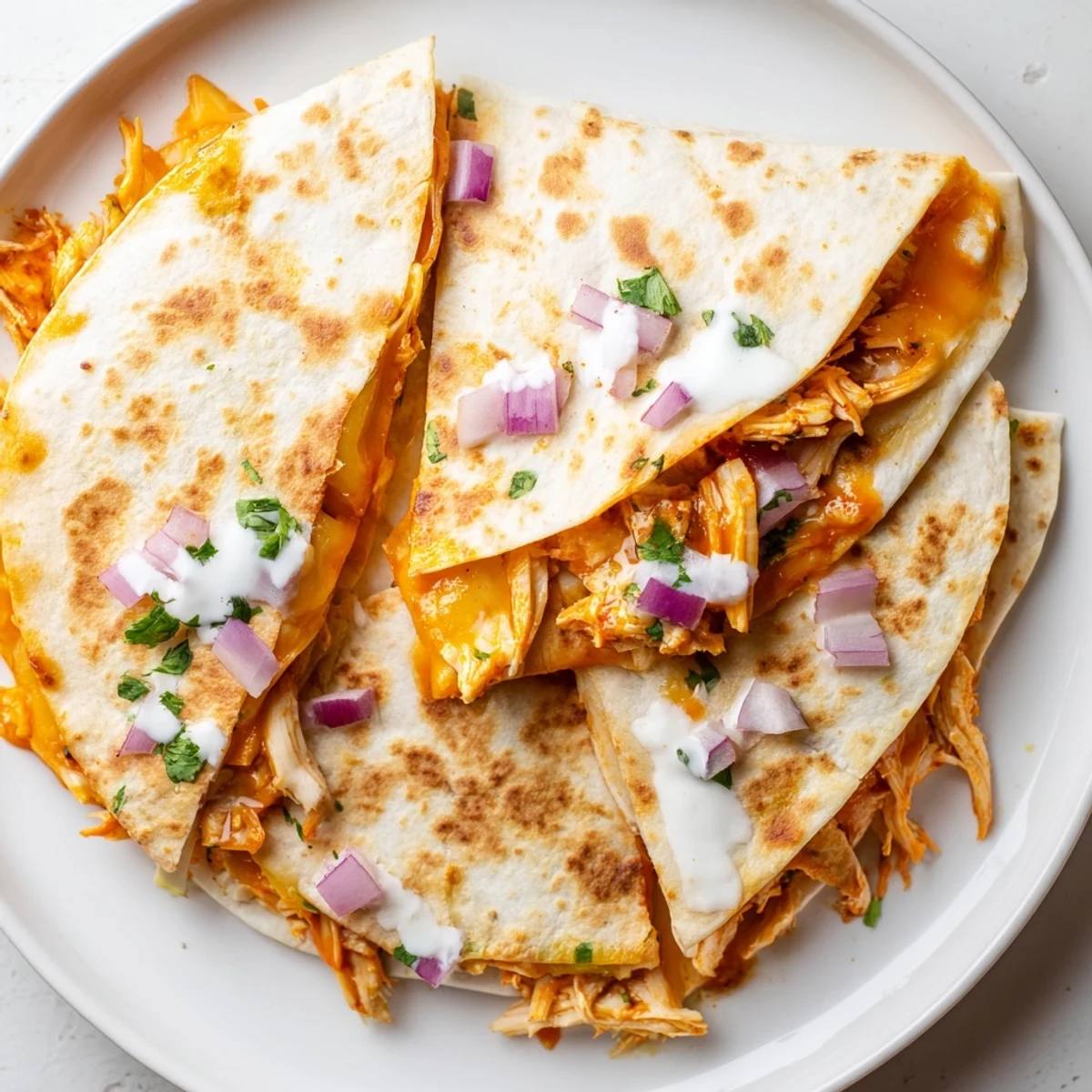 Golden-brown Buffalo Chicken Quesadilla, oozing with melted cheese and ready to eat, a perfect game-day snack.