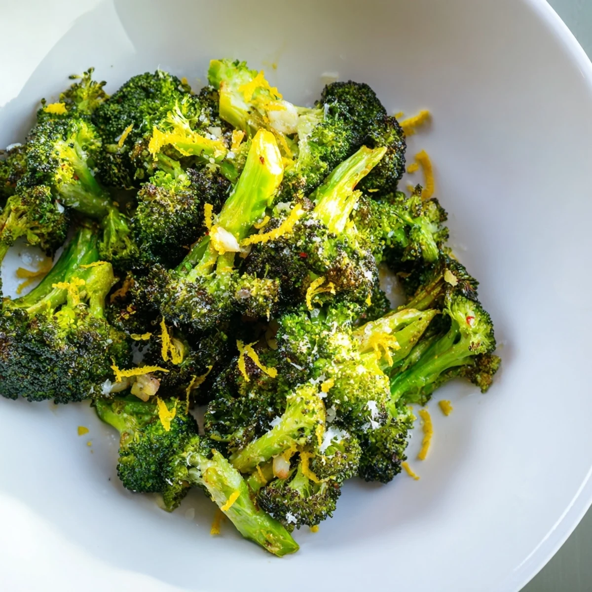 Vibrant Lemon Garlic Roasted Broccoli glistens on a baking sheet, ready for a healthy dinner.