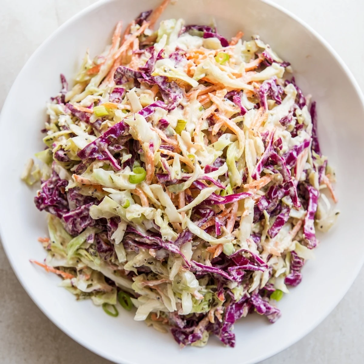 Creamy Quick Coleslaw Salad, with a tangy dressing clinging to crisp shredded greens, ready in minutes.