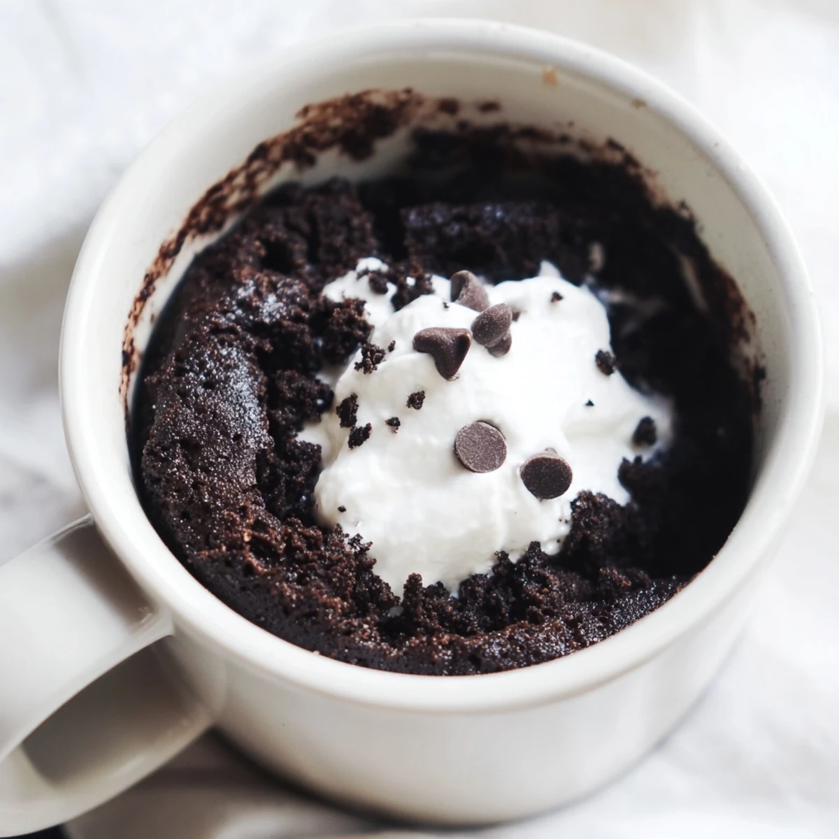 Fluffy Oreo mug cake, a quick chocolate dessert, ready to enjoy in minutes.