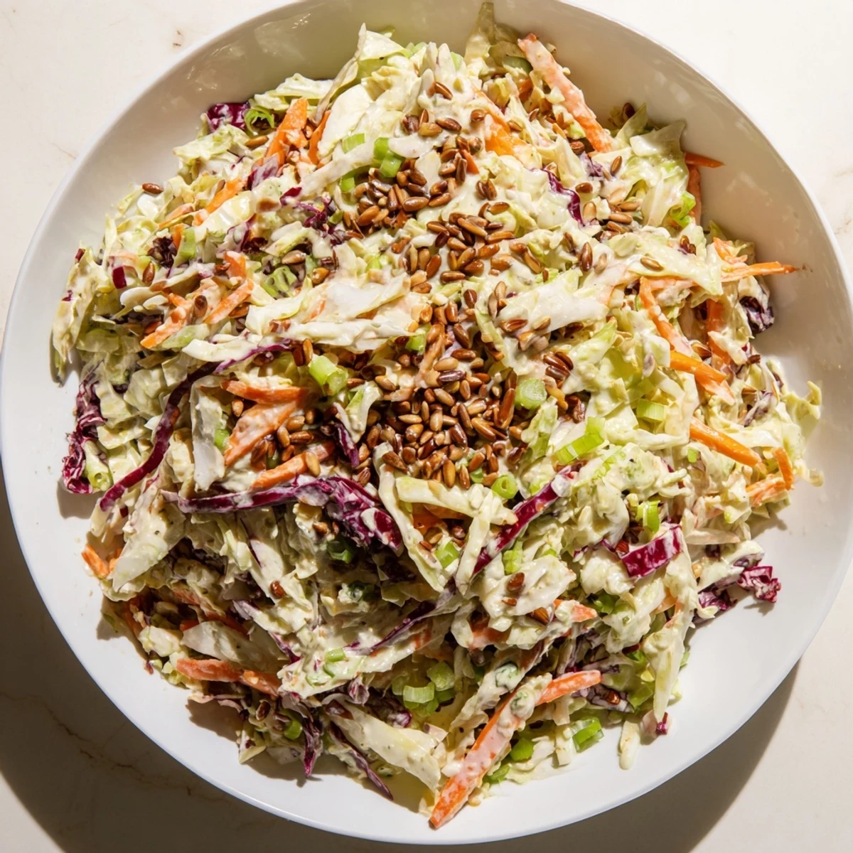 Vibrant image of the prepared Crunchy Coleslaw Salad, capturing the crisp texture and creamy dressing.
