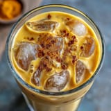 Refreshingly chilled Turmeric Golden Milk Iced Latte with warming spices and a smooth finish.