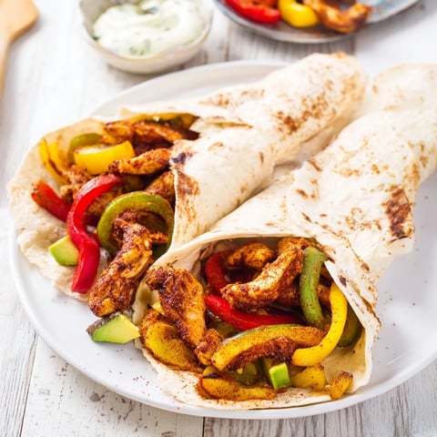 Sheet-Pan Fajita Chicken Rainbow Wraps, featuring savory chicken and colorful roasted vegetables, ready to enjoy.