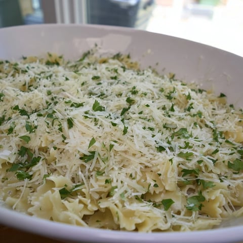 Steaming 15-Minute Garlic Parmesan Pasta, coated in a luscious, creamy, dairy-based sauce and fresh Parmesan.