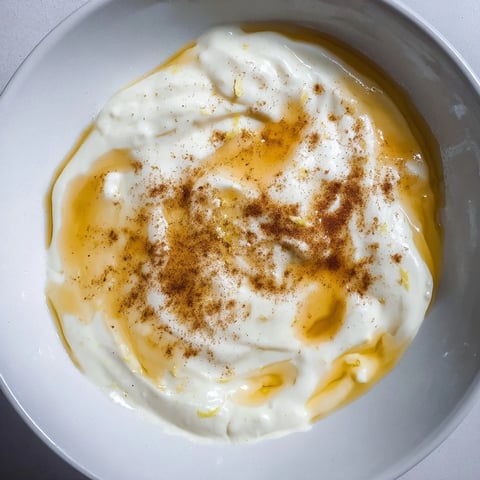 A vibrant bowl of the Greek Yogurt Fruit Dip alongside juicy, colorful summer fruits.