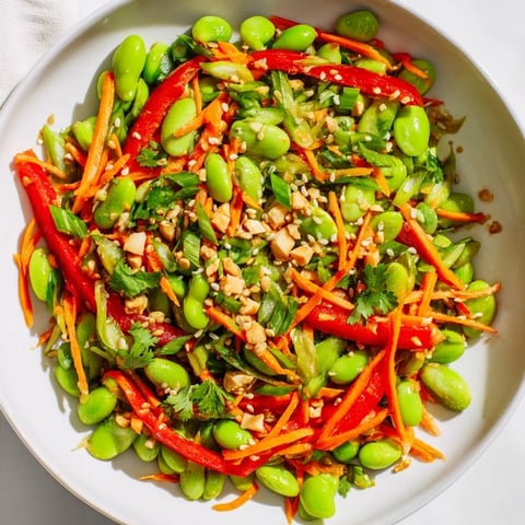 Fresh, vibrant Asian Edamame Salad with colorful veggies and a savory sesame ginger dressing.