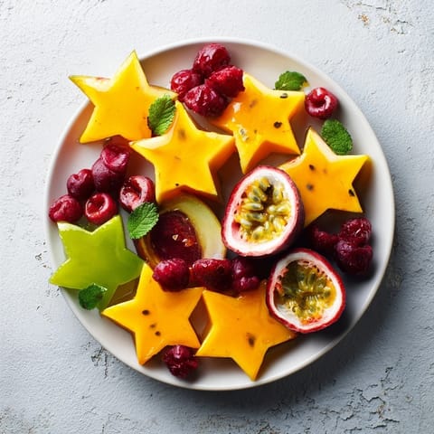A close-up view of the refreshing starfruit and berry platter, glistening with optional lime juice.