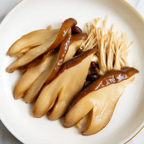 Artistic overlapping fans of salty seaweed and pickled vegetables plus the Umami Bomb Asian Delight.