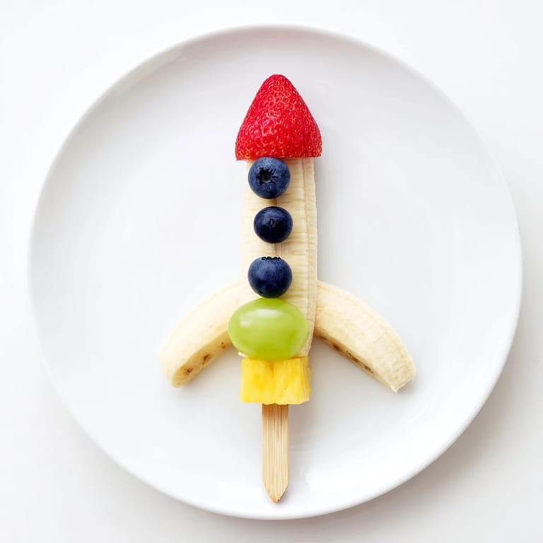Colorful Rocket Ship Fruit Skewers feature bright fruit, perfect for parties or a healthy snack.