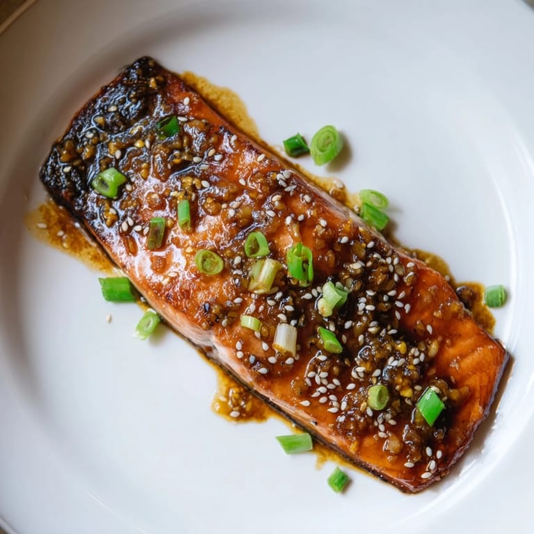 Golden-brown skin graces flaky ginger soy glazed salmon, a delicious Asian-inspired main course tonight.