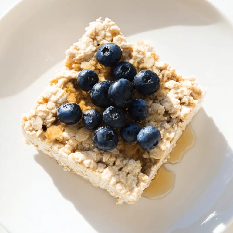 A slice of baked Protein Pancake Oats, offering a hearty, protein-packed start to your day.