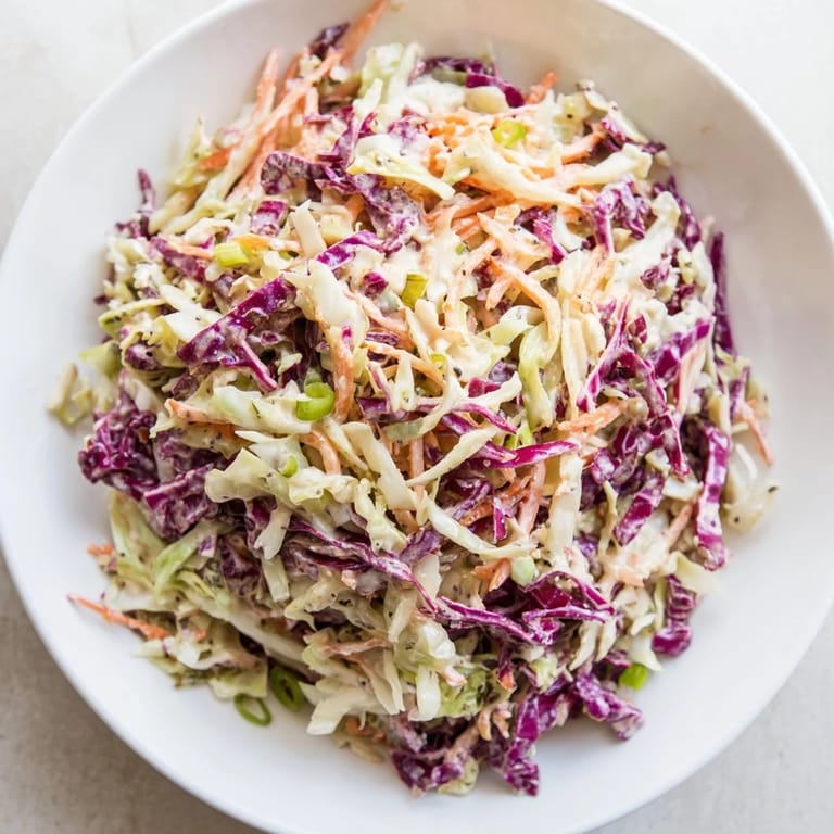 Creamy Quick Coleslaw Salad, with a tangy dressing clinging to crisp shredded greens, ready in minutes.