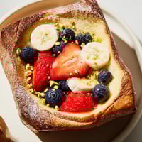 Golden-brown viral yogurt toast with a creamy yogurt filling and colorful fresh fruit, ready to enjoy.